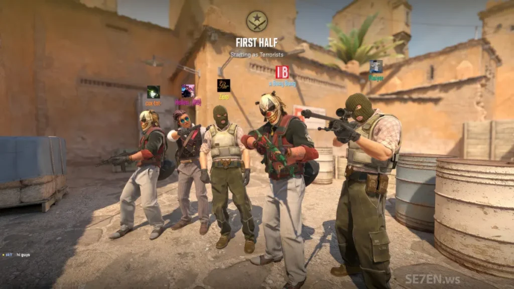 The CS2 terrorists standing in front of a building.